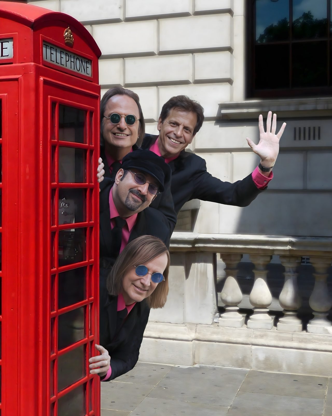 The British Invasion Years posing by a London phone booth