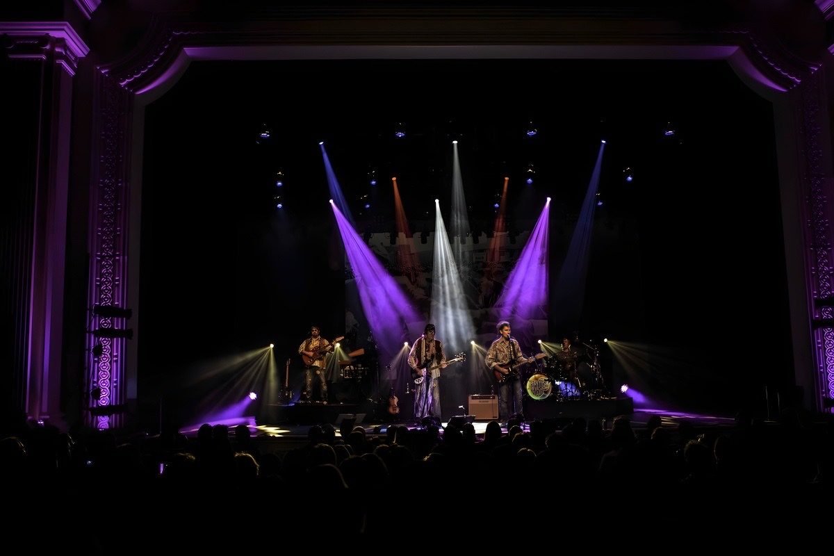 The British Invasion Years on a packed theater stage