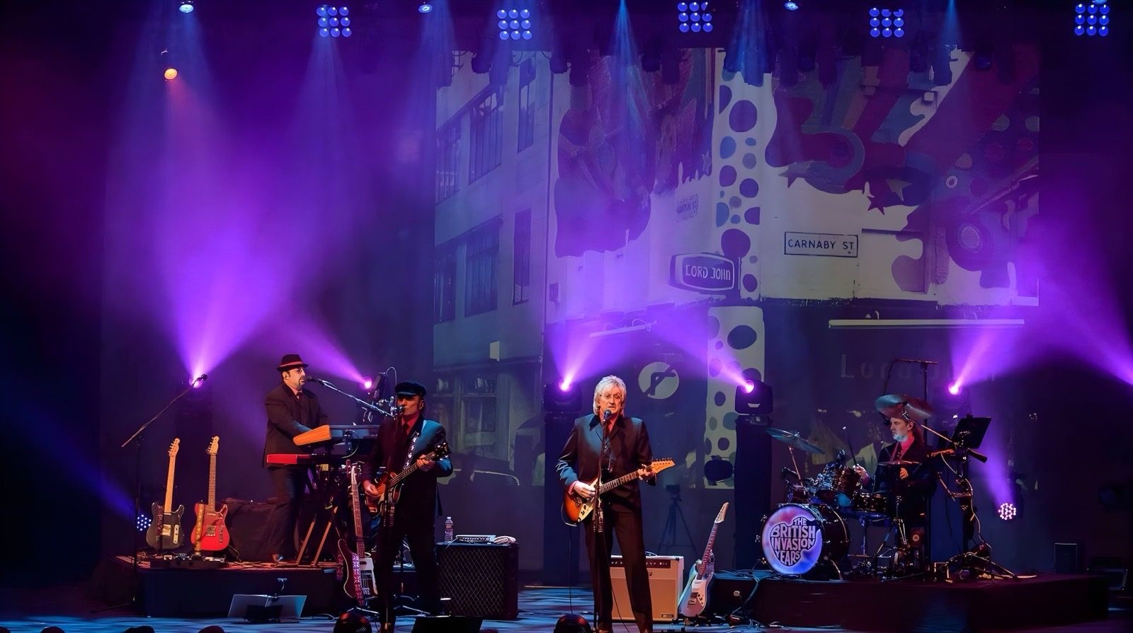 The British Invasion Years, band onstage carnaby backdrop