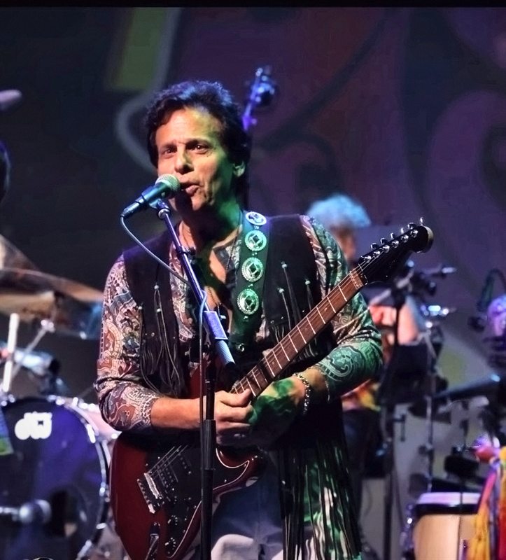 The British Invasion Years, Joe LaFragola singing under green stage lights