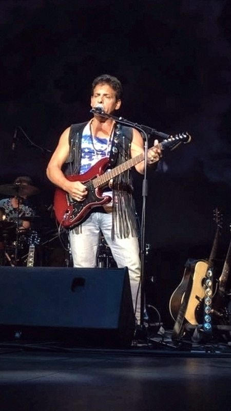 The British Invasion Years, Joe LaFragola at the vocal mic on a darkened stage